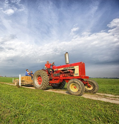 image of people riding a tractor