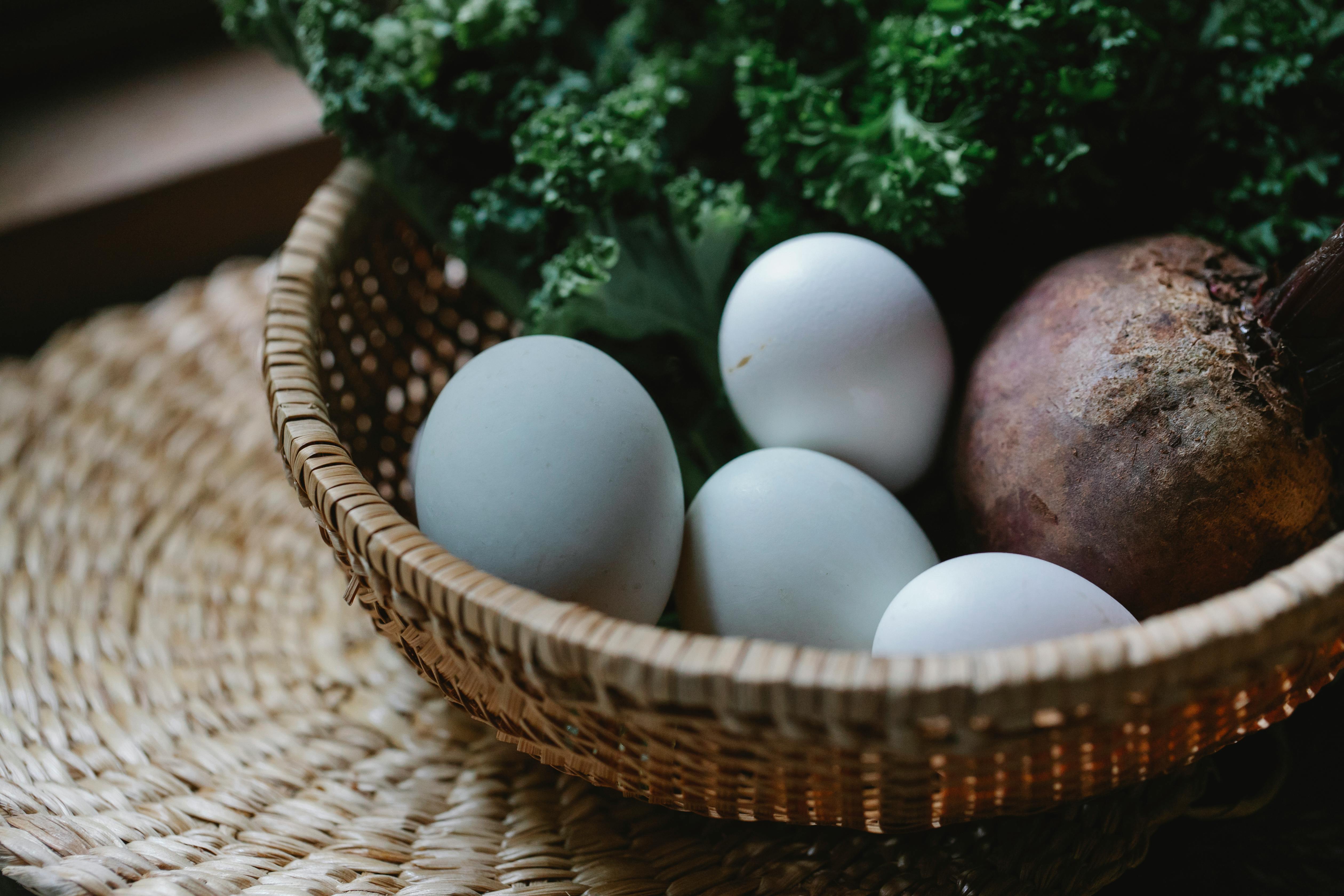 basket with eggs and vegetables